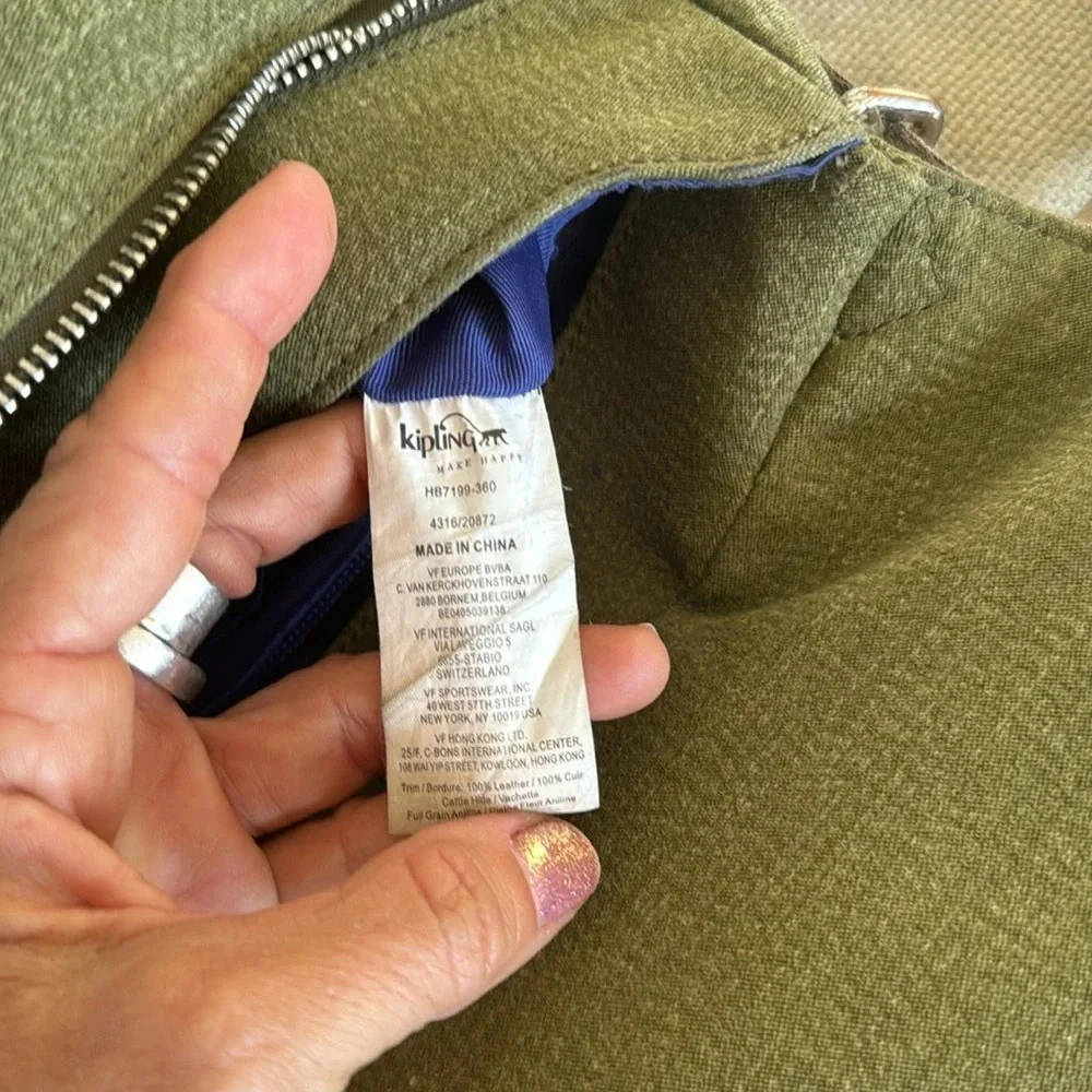 Kipling moss green with colbalt blue lining crossbody bag